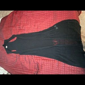 Black sleeveless duster